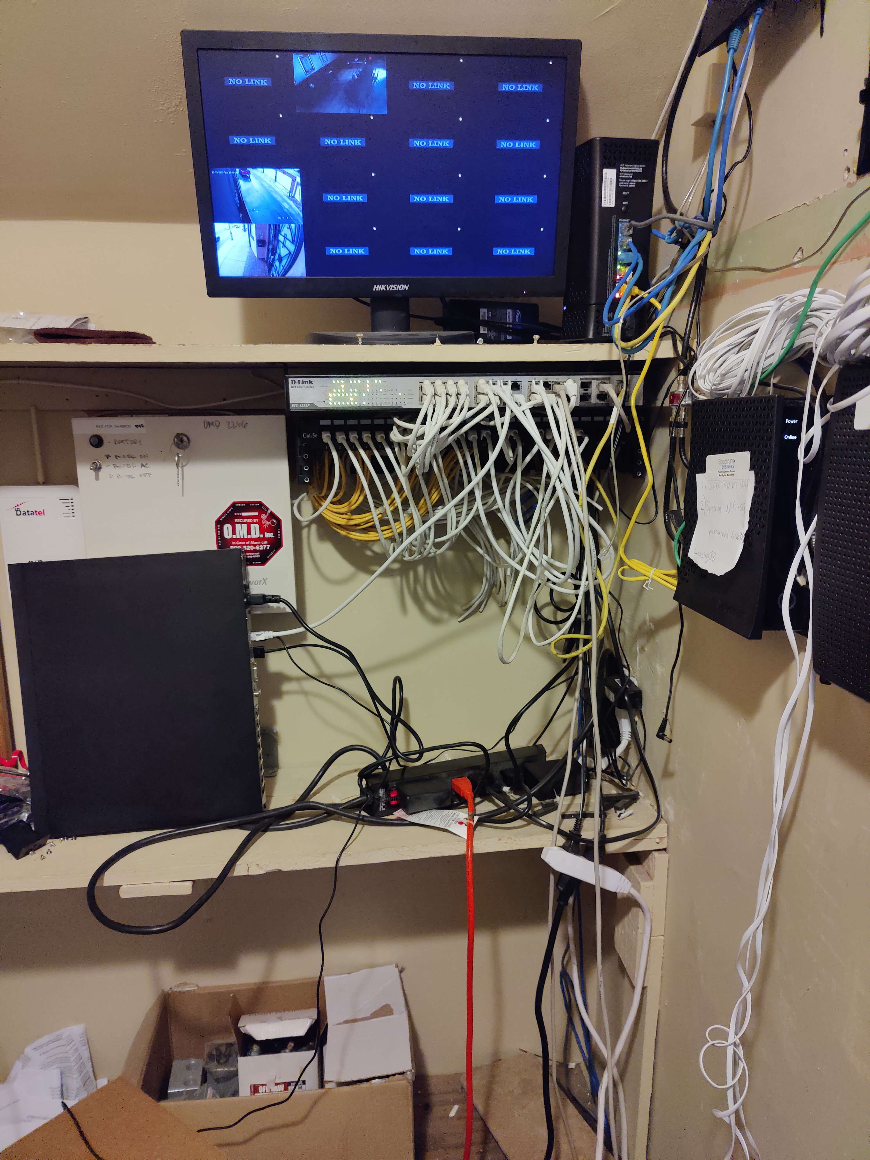 CCTV server closet before system upgrade - old Hikvision NVR setup